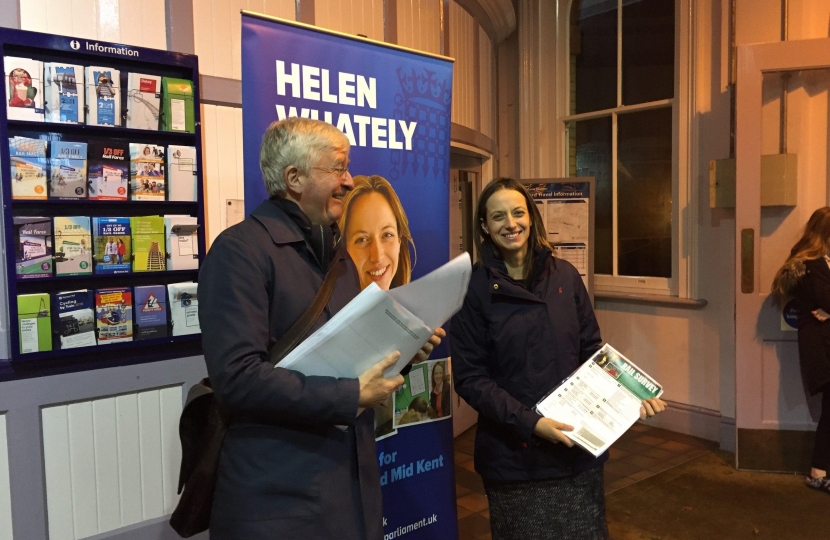 Handing out surveys at Faversham station