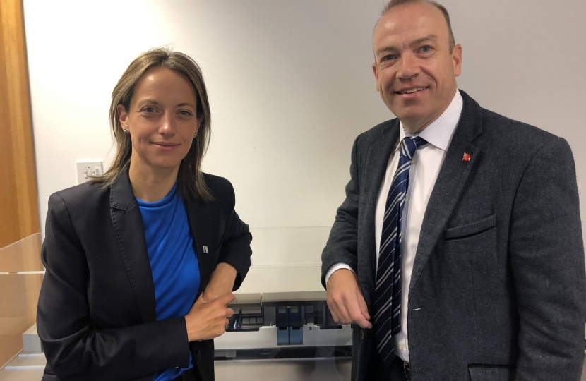 Helen Whately and the Rail Minister in front of a model of a class 700 Thameslink train