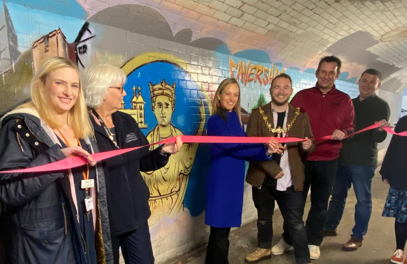 Helen and others unveiling the new mural.