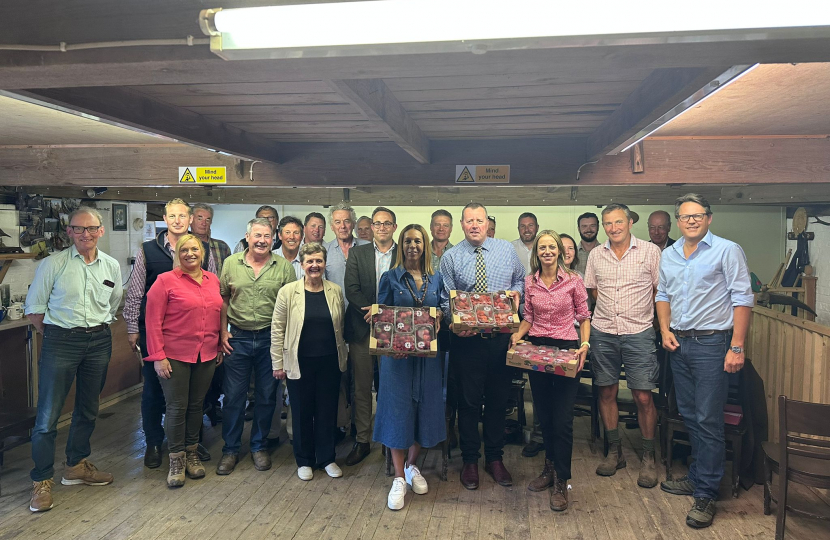 Helen with the Farming Minister and local farmers