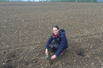 Helen planting a tree 