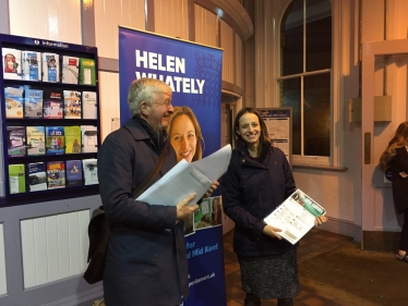 Handing out surveys at Faversham station