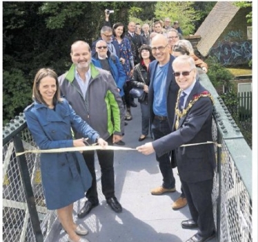 Cutting the ribbon on the restored footbridge