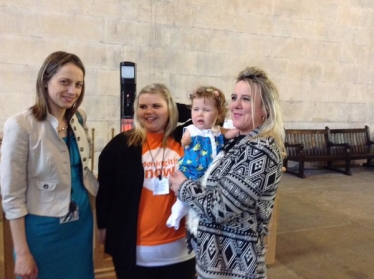 Helen with meningitis survivor Harmonie Rose and her family