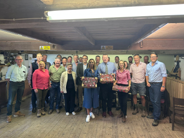 Helen with the Farming Minister and local farmers