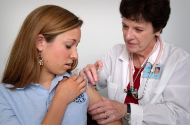 File photo: A girl being vaccinated